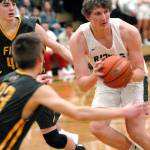 Port Angeles John Vaara, right, plays for the Roughriders in December 2019. High-risk indoor sports such as basketball and wrestling can return in late April under the states new Phase 3 COVID-19 guidelines. Spring sports with increased fans begin next week. (Keith Thorpe/Peninsula Daily News)