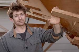 Leo Goolden and Clallam County have reached an agreement to move the 1910 wooden yacht he has been restoring in Sequim by Sept. 18. This screen shot is from a YouTube video posted March 13 by the Sampson Boat Co. (Sampson Boat Co. via YouTube)