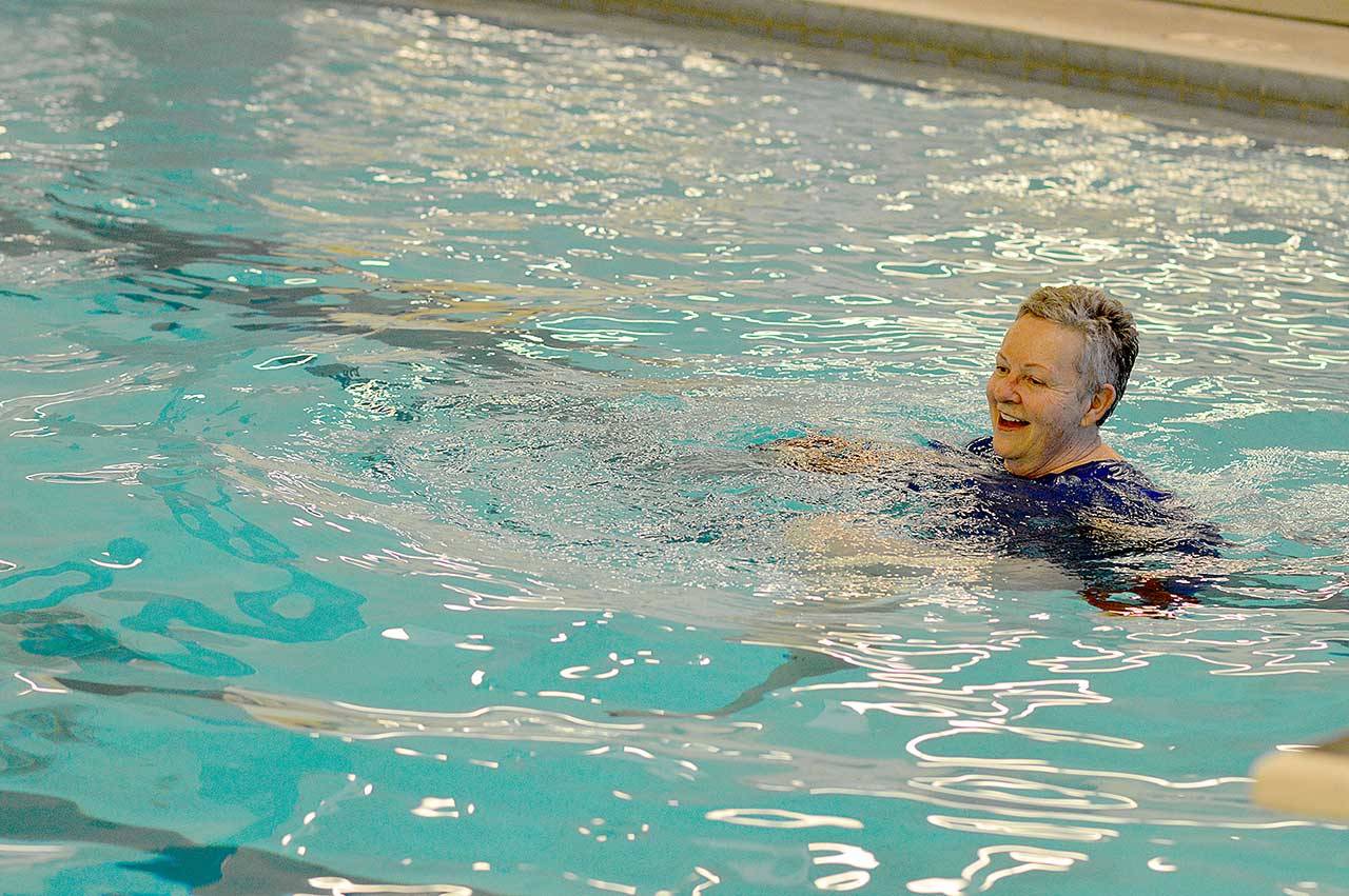 Houlton Madinger of Port Townsend is among the first to enjoy the Mountain View Pools 84-degree water Monday morning. The city pool, at 1925 Blaine St., has reopened for lap swimming and independent water aerobics by reservation from 7 a.m. to 11 a.m. Monday through Friday. For more information, visit cityofpt.us/pool or phone 360-385-POOL (7665). (Diane Urbani de la Paz/Peninsula Daily News)
