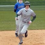 Port Angeles Landon Seibel rounds second past East Jeffersons Ryan Popp after Seibel hamnered a bases loaded homer in the third inning on Tuesday at Port Angeles Civic Field.
Keith Thorpe/Peninsula Daily News