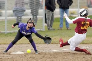 Sequim shortstop Hannah Bates looks to put a tag on a Kingston baserunner in the Wolves 19-3 win over the visiting Buccaneers on Wednesday. (Michael Dashiell/Olympic Peninsula News Group)