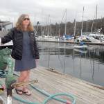 Keith Thorpe/Peninsula Daily News
Port Angeles Yacht Club Commodore Erika Hansen-Dahlin stands on the Port Angeles Boat Haven fuel dock, a feature destined to be replaced as part of $2.1 million in improvements approved by the Port of Port Angeles.