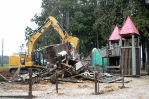 Keith Thorpe/Peninsula Daily News
An excavator operated by Greg Hopf of Port Angeles-based 2 Grade, LLC tears down a portion of the Dream Playground at Erickson Playfield in Port Angeles on Saturday to make way for a new play structure scheduled to be built this summer.