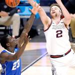 Creighton forward Damien Jefferson (23) and Gonzaga forward Drew Timme (2) battle for a loose ball in the second half of a Sweet 16 game in the NCAA mens college basketball tournament at Hinkle Fieldhouse in Indianapolis on Sunday. (AJ Mast/The Associated Press)