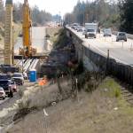 Cranes sit at the site of the new U.S. Highway 101 bridge over Siebert Creek between Port Angeles and Sequim after three out of six 175-foot-long concrete girders were hoisted into place Tuesday.
Traffic delays of up to 20 minutes at the site are possible today as heavy machinery used to place the remaining girders occupies the parallel bridge.
The project was designed to replace an aging culvert that was a hinderance to fish passage in Siebert Creek, with additional culvert removal underway at nearby Bagley Creek.
Traffic has been reduced to a single lane in each direction at both construction sites. (Keith Thorpe/Peninsula Daily News)