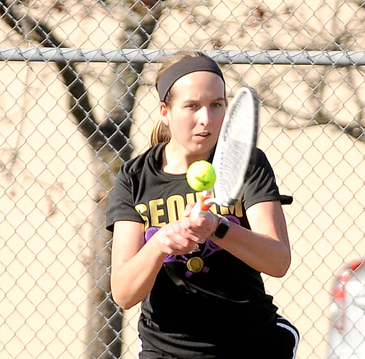 Sequims Kalli Wiker, a defending state champion in tennis, hits a volley against North Mason on Monday. Wiker won her match in straight sets. (Michael Dashiell/Olympic Peninsula News Group)