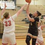 Peninsulas Amari Brown puts up a runner over the defense of Skagit Valleys Melissa Frien during the Pirates 51-36 road loss. (Rick Ross/Peninsula College)