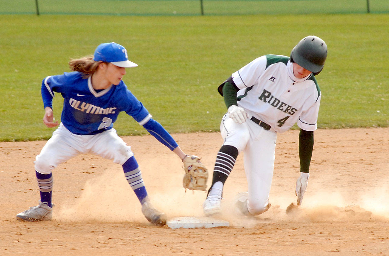 Keith Thorpe/Peninsula Daily News Port Angeles lead-off batter Wyatt Hall, right, arrives at second ahead of the tag from Olympic second baseman K. Jeter after Hall doubled in the first inning at Port Angeles Civic Field.