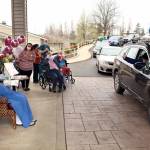 Local law enforcement, first responders, and friends and family of Lorraine Hansen drove through waving and wishing her well Friday morning at the Port Townsend Life Care Center in honor of her 104th birthday on Saturday, April 3, 2021. (Zach Jablonski/Peninsula Daily News)