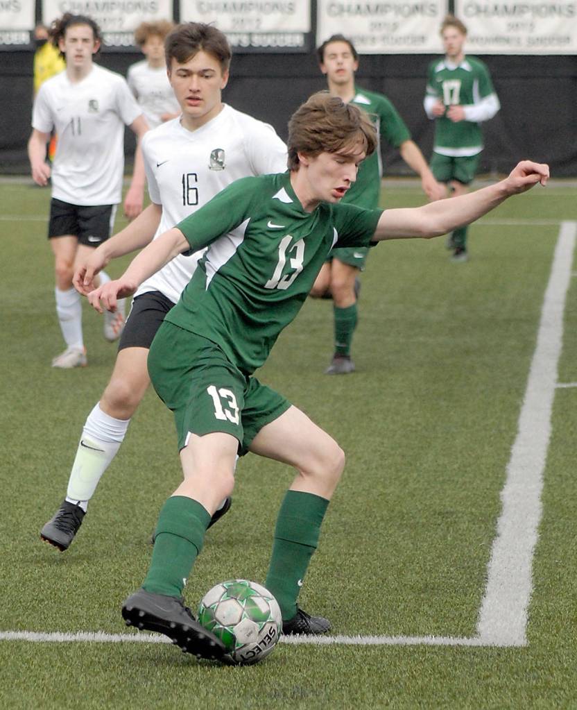 Keith Thorpe/Peninsula Daily News Port Angeles Josiah Long, front, controls the ball while being approached by Klahowyas Tyler Oelschlager during Saturdays match in Port Angeles.
