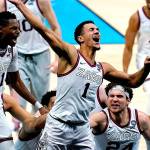 Gonzaga guard Jalen Suggs (1) celebrates making the game winning basket against UCLA during overtime in a men's Final Four NCAA college basketball tournament semifinal game, Saturday, April 3, 2021, at Lucas Oil Stadium in Indianapolis. Gonzaga won 93-90. (AP Photo/Michael Conroy)