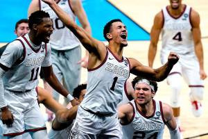 Gonzaga guard Jalen Suggs (1) celebrates making the game winning basket against UCLA during overtime in a men's Final Four NCAA college basketball tournament semifinal game, Saturday, April 3, 2021, at Lucas Oil Stadium in Indianapolis. Gonzaga won 93-90. (AP Photo/Michael Conroy)