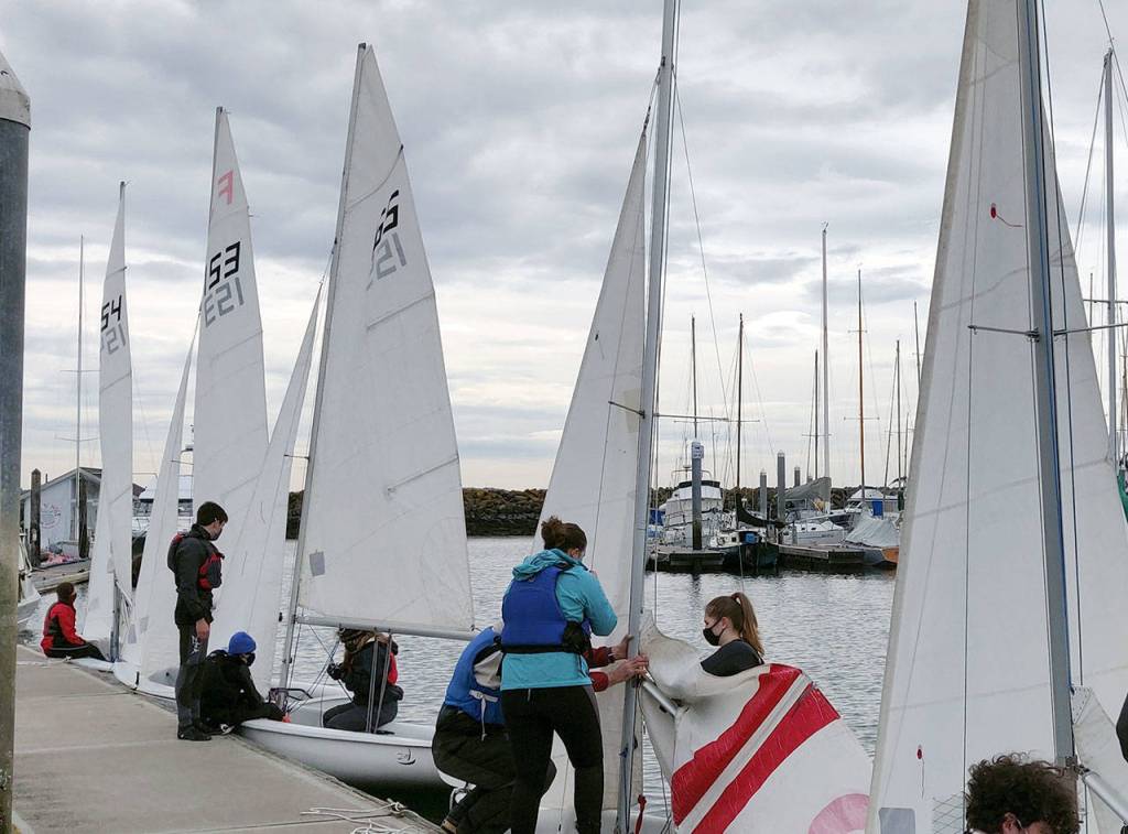 Competitors in a regatta featuring Port Townsend and Port Angeles high school sailing team members prepare their sails.
Competitors in a regatta featuring Port Townsend and Port Angeles high school sailing team members prepare their sails.