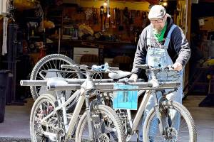 After a long winter, kinetic sculptor Colin Bartle brings his machines out into the Port Townsend sunlight on Sunday. Hes among the builders hoping to join Octobers Great Port Townsend Bay Kinetic Sculpture Race. (Diane Urbani de la Paz/Peninsula Daily News)