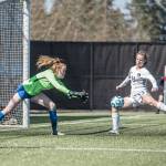 Jesse Major/for Peninsula Daily News
Peninsula's Makenna Warren, right, sweeps her leg onto a perfectly-positioned corner kick from Miya Clark as Edmonds goalkeeper Emily Morandi defends during the Pirates' 3-0 home opener win Monday. Warren scored a goal on the play.