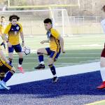 Spartans from left Juan Pablo Flores, Tony Flores-Hernandez and Andres Santos combine forces against Montesano on Tuesday at Spartan Stadium in Forks. (Lonnie Archibald/for Peninsula Daily News)