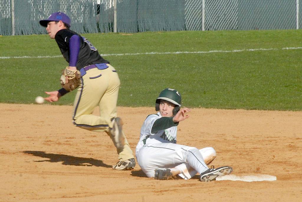Sequim shortstop Michael Grubb tosses the ball in after ending the fourth inning by catching Port Angeles James Burkhardt off the bag on Wednesday at Port Angeles Civic Field. (Keith Thorpe/Peninsula Daily News)