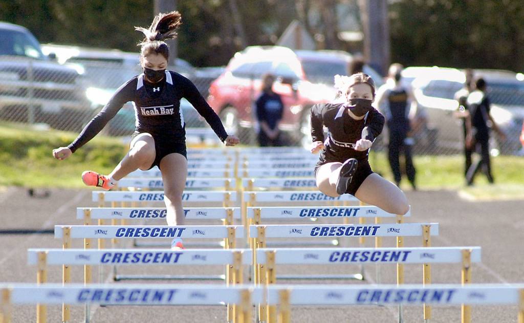 Keith Thorpe/Peninsula Daily News Neah Bay teammates Ruth Greene, left, and Kianah Cameron race against each other as the only competitors in the girls 100-yard hurdles on Friday.
Keith Thorpe/Peninsula Daily News Neah Bay teammates Ruth Greene, left, and Kianah Cameron race against each other as the only competitors in the girls 100-yard hurdles on Friday.