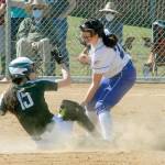Port Angeles Emi Halberg makes it safely to second as Sequims Hannah Bates attempts the tag on Saturday in Port Angeles. (Keith Thorpe/Peninsula Daily News)