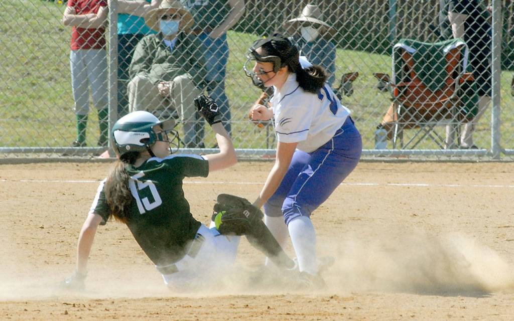 Port Angeles Emi Halberg makes it safely to second as Sequims Hannah Bates attempts the tag on Saturday in Port Angeles. (Keith Thorpe/Peninsula Daily News)