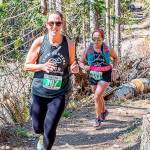 Debbie Proctor of Vancouver (307) and Sherry Xiong of Port Angeles (343) run in the half-marathon of the Olympic Adventure Trail run Saturday. (Photo by Matt Sagen, Cascadia Films)