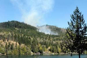 Smoke rises from a wildland fire on state Department of Natural Resources land north of Lake Sutherland on Tuesday. (Keith Thorpe/Peninsula Daily News)