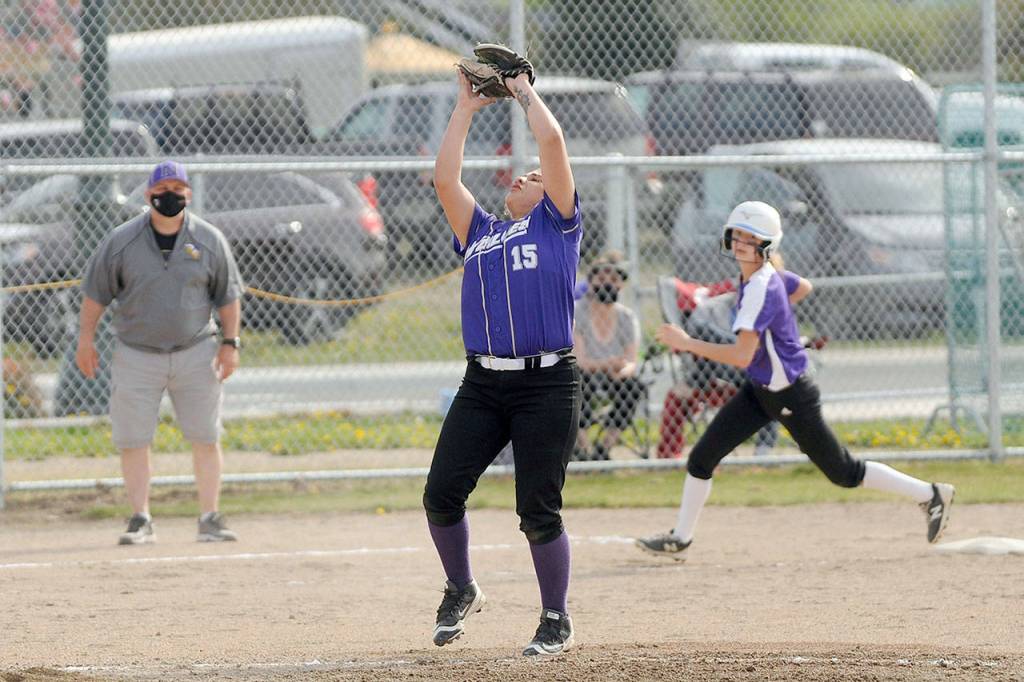 Sequim third baseman Kailyn Lopez snags a popup in the Wolves Wednesday game against visiting North Kitsap. (Michael Dashiell/Olympic Peninsula News Group)