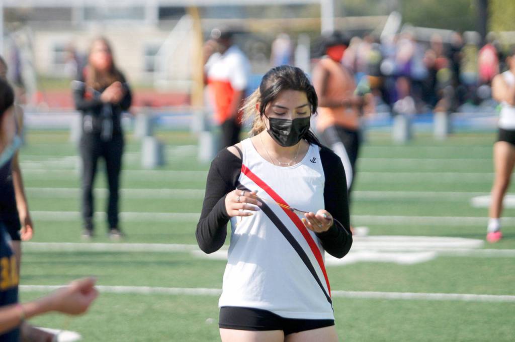 Port Townsends Stephanie Sanchez receives her ribbon after finishing sixth in the 100-meter hurdles at the Class 1A/2A/3A Olympic League Championships at Bremerton High School. (Mark Krulish/Kitsap News Group)