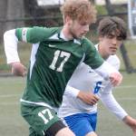 Keith Thorpe/Peninsula Daily News
Port Angeles' Porter Litle, front, races with Bremerton's Jeffery Pickering for the ball on Saturday in Port Angeles.