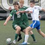 Port Angeles Sean Rankin, left, and Bremertons Brennan Galoway, right, tussle for the ball as Rankins teammate, Zak Alton, covers from behind during Saturdays match at Peninsula College in Port Angeles. (Keith Thorpe/Peninsula Daily News)