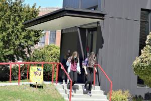 A variety of inspirational messages  the Signs of Hope  dot the Port Townsend High School campus, where, from left, Sage Wyatte, Jasmine Hansen and Gabby Newton head for class. (Diane Urbani de la Paz/Peninsula Daily News)