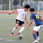 Group Sequims Christian Gonzales looks to dribble past Bainbridges Damoni Mckenna-Greenawalt during the Olympic League Boys Soccer Championship. (Mark Krulish/Kitsap News Group)