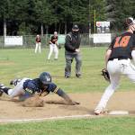 Lonnie Archibald/for Peninsula Daily News
Forks' Trey Baysinger slides into third while in the background Riley Pursley heads for second during a successful double steal against Kalama. The Spartans edged the Chinooks 4-3 to advance to the district championship.