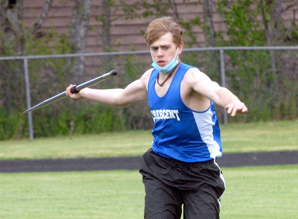 Keith Thorpe/Peninsula Daily News Brendon Bergstrom of Crescent throws in the boys javelin on Friday in Joyce.