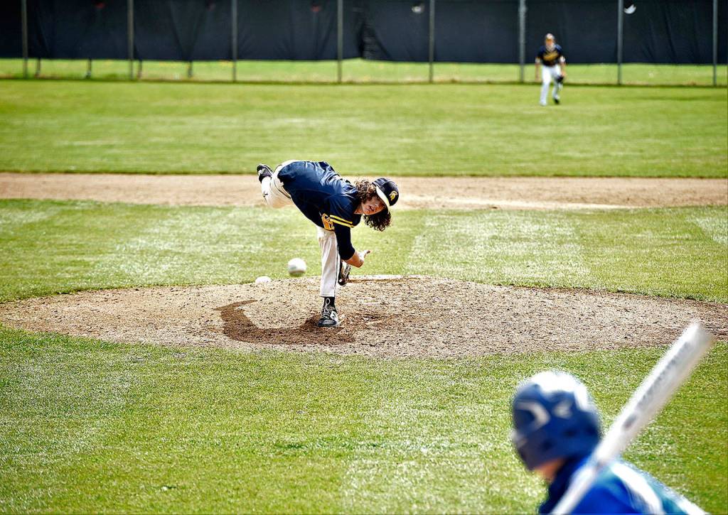 Forks Carter Windle pitches to Toutle Lake in the Southwest 2B/1A district championship. Windle went up against a University of Oregon recruit and held his own, allowing just one earned run and striking out eight. (Jordan Nailon/Longview Daily News)