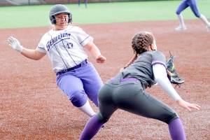 Sequim's Lily Fili slides into third base against North Kitsap on Saturday. (Mark Krulish/Kitsap News Group)