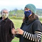 Community Wellness Project board member Shelby Smith, right, talks with master gardener Candice Gohn about Chimacums farms-to-schools program Monday evening. (Diane Urbani de la Paz/Peninsula Daily News)