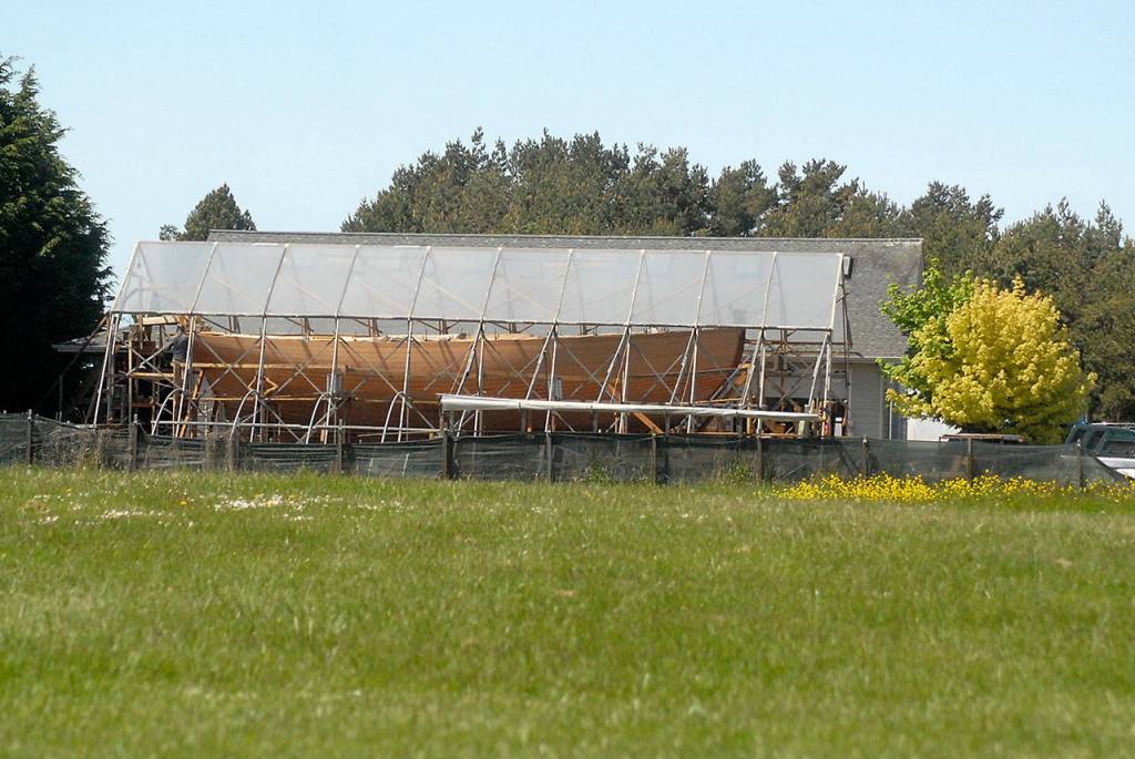 The racing cutter Tally Ho sits under a protective covering on Tuesday in rural Sequim. (Keith Thorpe/Peninsula Daily News)