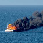 A 48-foot fishing yacht burns in the Strait of Juan de Fuca in this photograph captured by Port Angeles resident Ken Campbell.