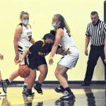 Spartans from left Rylee Bouchard, Kyra Neel and Chloe Leverington with only one practice since softball season put the pressure on this North Beach player Tuesday evening in the Forks auxiliary gym where Forks defeated the Hyaks 71 to 35.  Photo by Lonnie archibald.