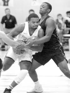 <strong>Keith Thorpe</strong>/Peninsula Daily News
Peninsulas Keith Seldon shoulders past Everetts Brycen Dillworth during the first half of Saturdays game in Port Angeles.