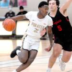 Keith Thorpe/Peninsula Daily News Peninsulas Marcus Rodgers, left, drives past Everetts Brayden Quantrille during Friday afternoons game at Peninsula College.