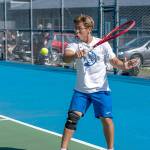 Steve Mullensky/for Peninsula Daily News

East Jefferson's Carter Cameron hits a backhand return against Klahowya's Evan Cole during a Tuesday afternoon match in Chimacum.