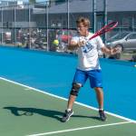 East Jeffersons Carter Cameron hits a backhand return against Klahowyas Evan Cole during a Tuesday afternoon match in Chimacum. (Steve Mullensky/for Peninsula Daily News)