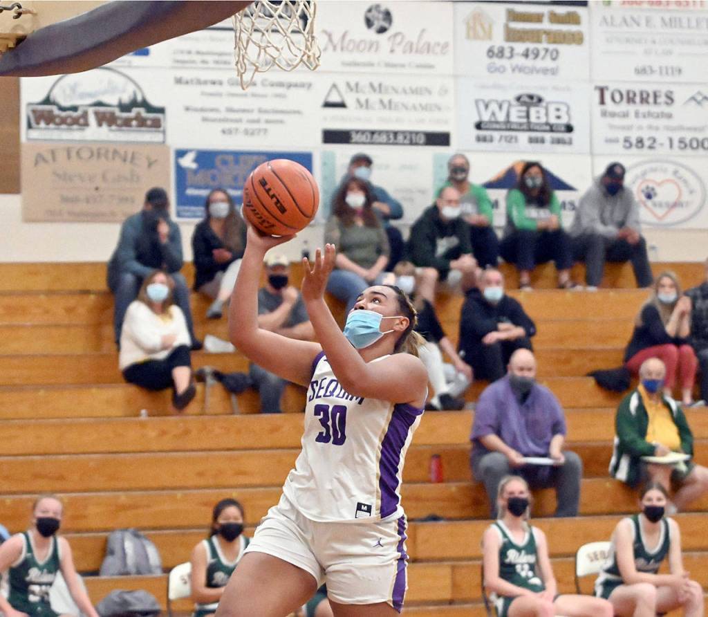 Sequims Jayla Julmist rises for a fast-break layup during a game with Port Angeles on Wednesday. Julmist recorded a double-double with 16 points and 14 rebounds. (Michael Dashiell/Olympic Peninsula News Group)
