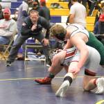 Port Angeles wrestling coach Rob Gale coaches Tom Arand during a match Saturday in Forks. (courtesy photo)