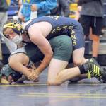 Spartan Colton Duncan pinned Roughrider Jack Harrelson in the 145 lb class..  Photo by Lonnie Achibald.