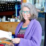 Author Corky Parker of Port Townsend gives a reading at the Ajax Cafe of her new book, La Finca: Love, Loss and Laundry on a Tiny Puerto Rican Island. (Diane Urbani de la Paz/Peninsula Daily News)