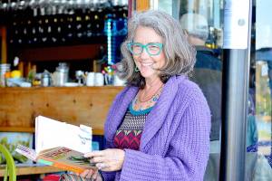 Author Corky Parker of Port Townsend gives a reading at the Ajax Cafe of her new book, La Finca: Love, Loss and Laundry on a Tiny Puerto Rican Island. (Diane Urbani de la Paz/Peninsula Daily News)