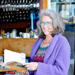 Author Corky Parker of Port Townsend gives a reading at the Ajax Cafe of her new book, La Finca: Love, Loss and Laundry on a Tiny Puerto Rican Island. (Diane Urbani de la Paz/Peninsula Daily News)